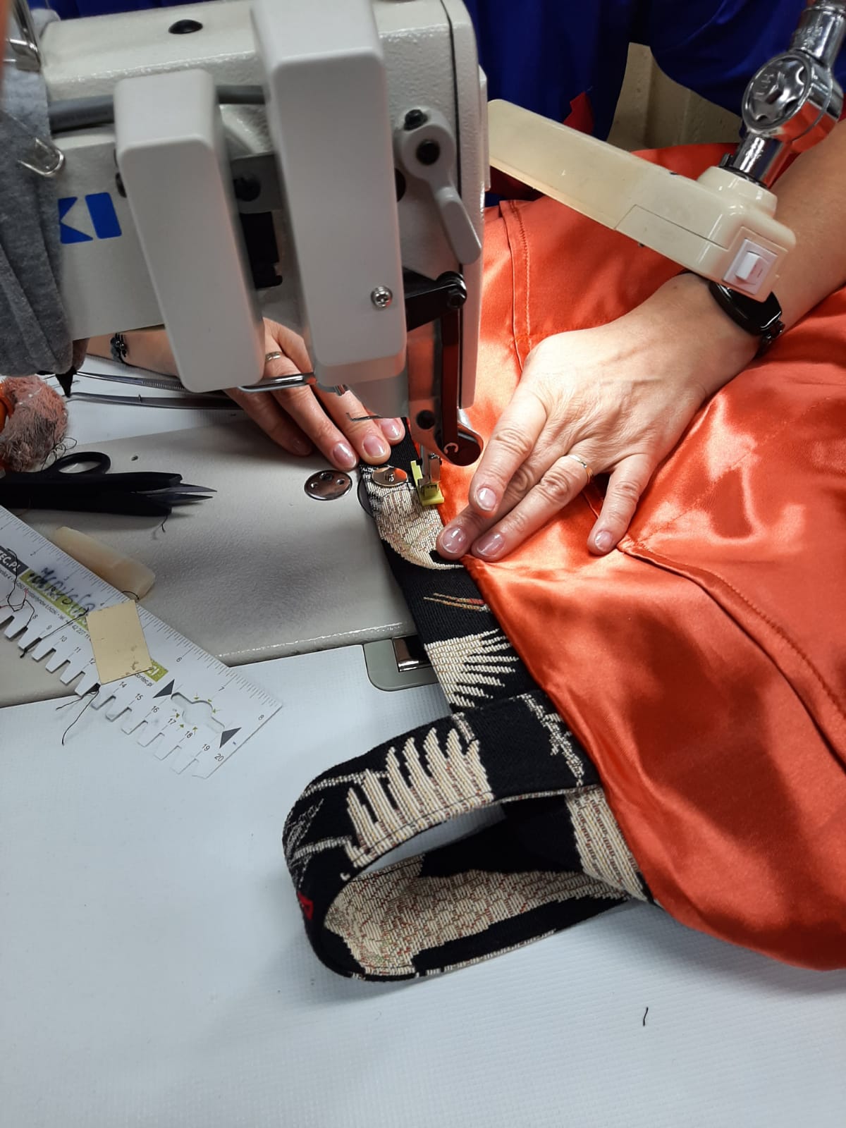 Maya showcasing bags handmade in europe